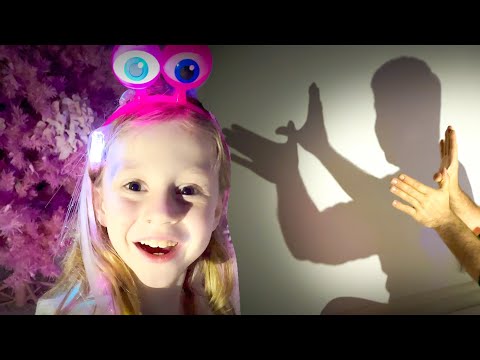 Nastya plays with shadow puppets and glowing toys